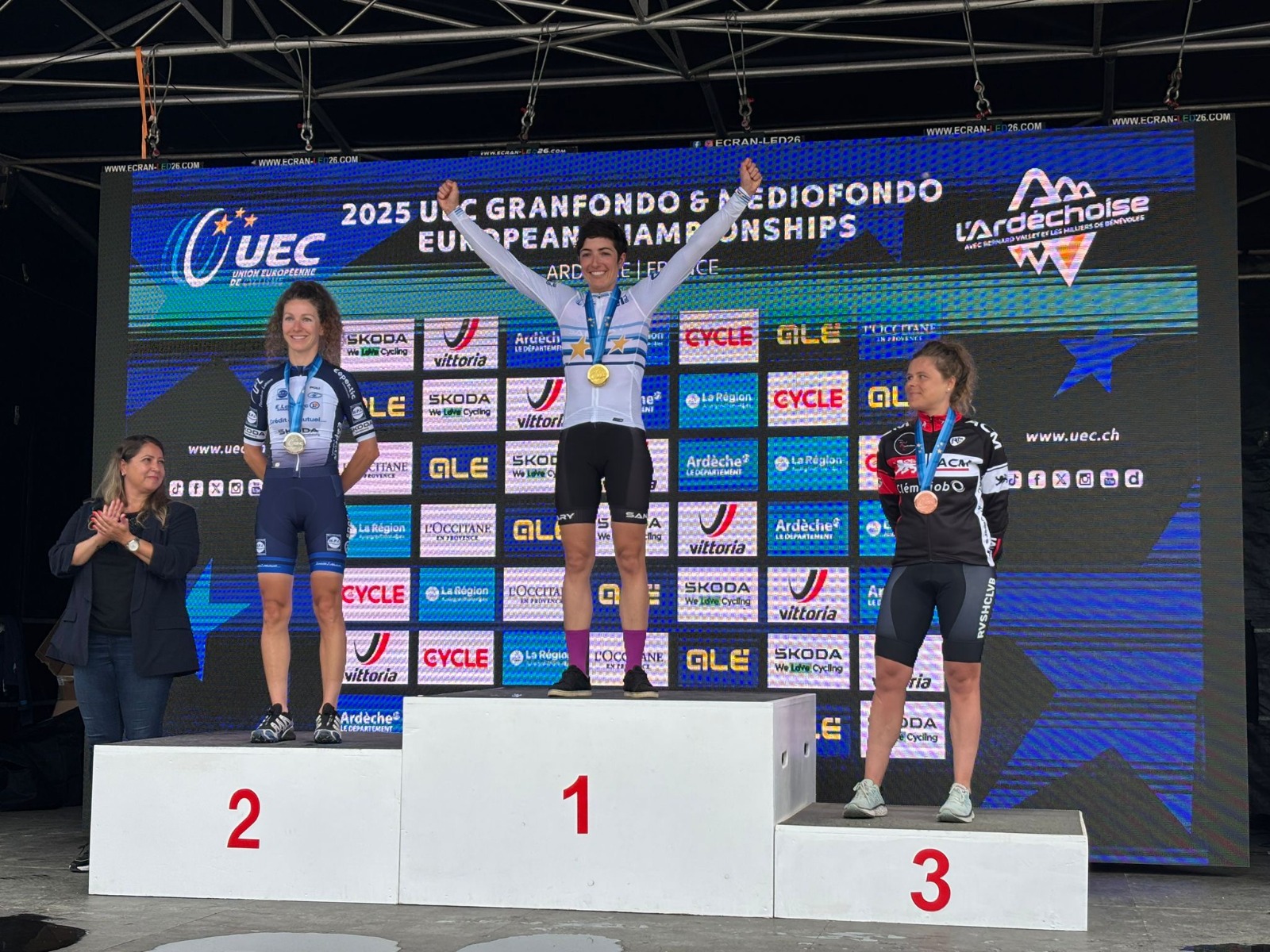 Marion Bessone on the top step of the 2025 UEC Granfondo European Championships podium, in the European champion's jersey