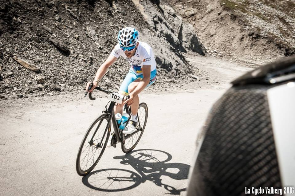 Rémi Chenu climbing a gravel mountain road, race number 103
